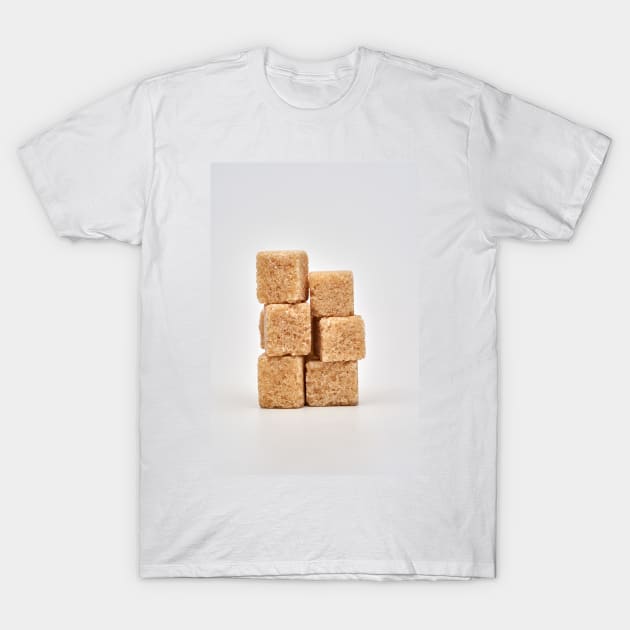 Closeup of brown sugar cubes on white T-Shirt by naturalis